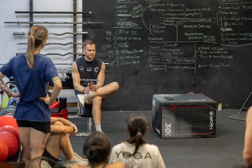 Wade teaching strength training in the gym